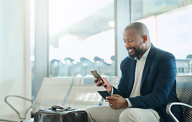 Image showing African businessman, phone and airport for texting, email or reading news on web app with passport. Corporate black man, international travel or smartphone for identity, cybersecurity or social media