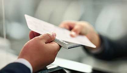 Image showing Ticket, travel and person giving a passport to a worker for documentation, holiday and airplane boarding. Flying, buying and hands at the airport with paper for traveling, identity document and check