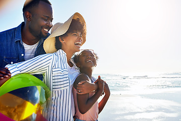 Image showing Black family, children or beach with a mother, father and daughter carrying a ball, walking on sand by the sea. Love, nature and ocean with a man, woman and girl child playing on the coast in summer