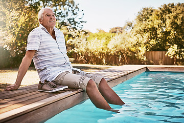 Image showing Relax, retirement and thinking with old man by swimming pool and for summer, peace and happy. Smile, calm and vacation with senior citizen with feet in water on break for happiness, holiday and fun