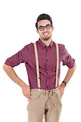 Image showing Portrait, nerd and man in studio, casual and smile, happy and content on white background. Young, handsome and male with geek aesthetic smiling, positive and confident while standing akimbo isolated