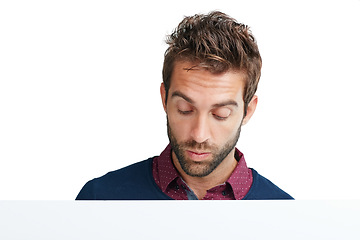 Image showing Face, thinking and mockup with a man in studio isolated on a white background for branding or product placement. Idea, mock up and curious with a handsome young male on blank advertising space