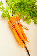 Image showing baby carrots bunch tied with rope