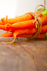 Image showing baby carrots bunch tied with rope