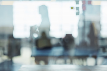 Image showing Reflection, glass and shadow of person in window while working at a corporate company. Professional, workplace and silhouette of blur employee in the office for work, meeting or coworking at agency