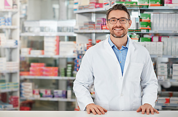 Image showing Pharmacy, portrait and pharmacist man smile for medicine, product on shelf and healthcare industry help desk. Trust, expert and medical professional worker for supplements, pills or drugs management