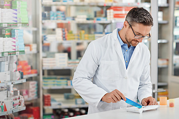 Image showing Pharmacist man, store and counting with pills, medicine and focus for health, product or sales. Medical professional, pharma expert or sorting medication in pharmacy for wellness, healthcare and job