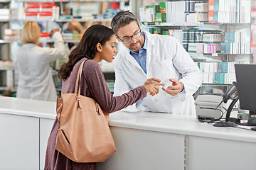 Image showing Medicine, help and pharmacist advice with side effects at health store counter for customer service. Pharmaceutical advice and opinion of worker helping girl with medication information at pharmacy.