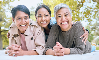 Image showing Portrait, family and sisters in a park with group of people, happy and laughing looking relax. Friends, senior ladies and women enjoying a picnic with together in spring, cheerful and excited outdoor