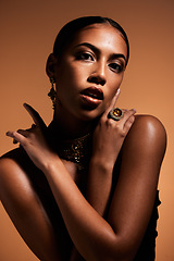 Image showing Elegant, vintage and portrait of a beautiful woman isolated on a brown studio background. Fashion, sexy and body of a young retro model with classy jewelry, style and fashionable on a backdrop
