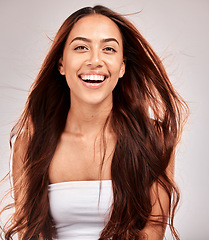 Image showing Beauty, hair and wind with portrait of woman for skincare, wellness and makeup cosmetics. Keratin, shampoo and balayage with face of girl for self care, luxury and skincare in studio background