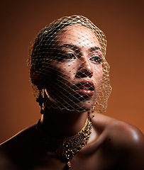 Image showing Net veil, classy and face of a woman thinking of fashion isolated on a brown studio background. Elegance, makeup and stylish vintage model with a fancy, retro and glamour accessory on a backdrop