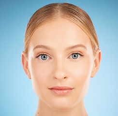 Image showing Portrait, cosmetics and woman with skincare, dermatology and natural beauty on blue studio background. Face, female and girl with makeup, wellness and grooming routine for health, smooth or soft skin