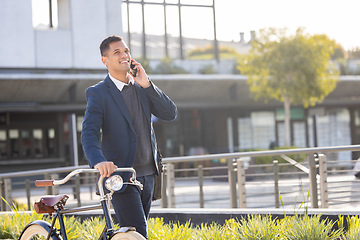 Image showing Phone call, bike and commute with a business man in the city using eco friendly transport for work travel. Mobile, bicycle and communication with a male employee thinking about his carbon footprint