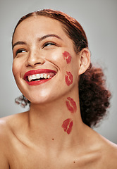 Image showing Makeup, red lipstick and kiss on face of woman model in studio for cosmetics, love and happiness. Beauty headshot of person happy for valentines day spa facial skin idea or skincare motivation