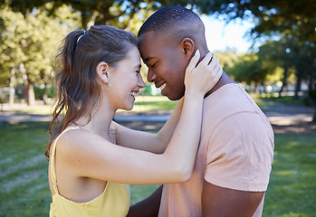 Image showing Smile, love and interracial couple at a park date with diversity, summer celebration and valentines day. Race, care and black man with partner or people together in garden happy for picnic with peace