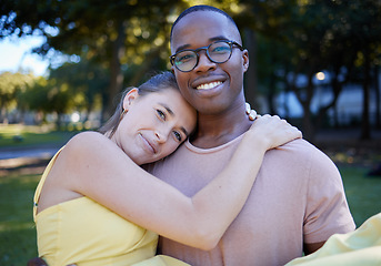 Image showing Couple hug in portrait with date outdoor, nature and happy people in interracial relationship with commitment in park. Love, trust and support with black man and woman, smile on face and fresh air