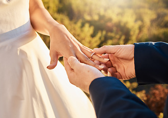 Image showing Couple hands, wedding ring and love ceremony outdoor with jewelry and save the date announcement. Engagement, together and marriage of people in nature at commitment and engagement event with faith