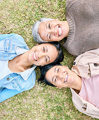 Image showing Portrait, family and mother, grandmother and adult daughter relax on grass, happy and bonding in a garden. Face, generations and women having fun, laughing and enjoying the weekend at a park together