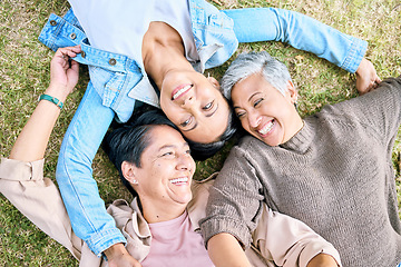 Image showing Park, friends relax and top view of women bonding, caring and enjoying quality time together. Peace, freedom and happy group of retired senior females lying on grass talking, chatting and having fun.