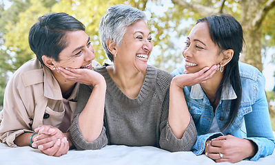 Image showing Love, senior women and friends at park on picnic blanket, bonding and enjoying quality time together outdoors. Peace, retirement and happy group of elderly females embrace and relaxing in nature.