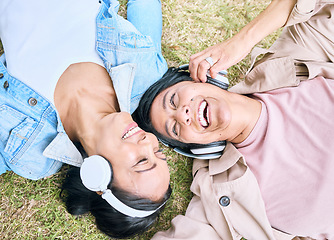 Image showing Face, friends and happy with women and headphones, listening to music outdoor with podcast and technology. Happiness top view, radio and audio streaming in park with people together and wellness