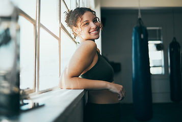 Image showing Portrait, window and woman with smile, fitness and workout for wellness, healthy lifestyle or exercise. Happy female, lady or athlete in gym training, sunshine or practice for cardio, energy or power