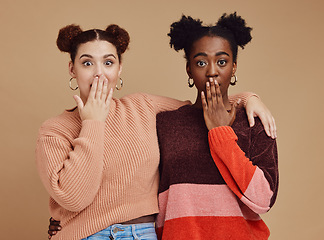 Image showing Surprise, portrait and girl friends with wow face of young women with secret and brown studio background. Gen z student surprised chat together with whisper and excited discussion with shock story