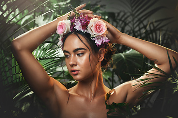 Image showing Beauty, forest and face of a woman with a flower crown standing by a tropical leaf background. Cosmetics, skincare and model from Mexico with a wellness skin routine with green plants in nature.