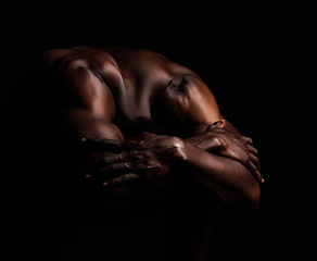 Image showing Art, masculinity and artistic shadows with african man posing naked in studio isolated against a dark background. Muscular, macho and artwork of a strong black man curled up with hands over his head