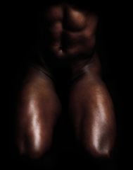 Image showing Fit, strong and muscular man isolated against black background and posing nude, bare or topless. Closeup of powerful, active or athletic bodybuilder showing muscles, sensual body and male physique