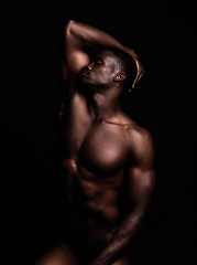 Image showing Sensual, nude and black man on dark background with muscular body, natural or dim light. Confident, African American male or strong person shirtless, athletic or bodybuilder with wellness or creative