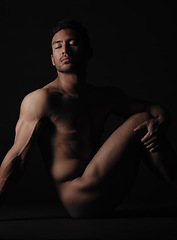 Image showing Nude, art and sensual with a model asian man in studio on a dark background for artistic body positivity. Skin, natural and artwork with a handsome young male posing naked on a black backdrop