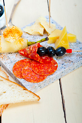 Image showing mix cold cut on a stone with fresh pears