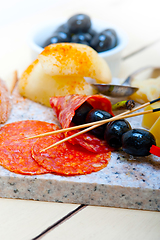 Image showing mix cold cut on a stone with fresh pears