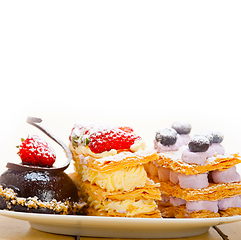 Image showing selection of fresh cream cake dessert plate