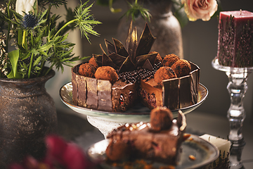 Image showing chocolate mousse cake with cherry