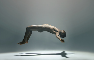 Image showing Float, man and naked model in a white background studio for creative art with shadow. Isolated, floating and nude body of a african male in the air with light showing artistic and erotic projection