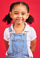 Image showing Portrait, child and girl in studio, happy and smile against a red background with mockup. Face, cheerful and trendy toddler standing against space, excited and positive, smiling and posing isolated