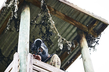 Image showing Paintball scout, tower and aiming for tango, enemy or opponent in sight ready to fire for victory, win or match point. Soldier in focus standing in fort with gun for game, military or army defense