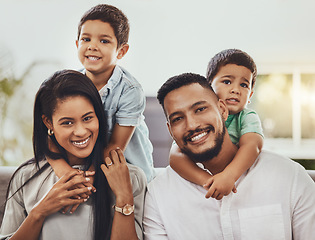 Image showing Mother, father and children hugging parents with smile relaxing together for holiday or weekend at home. Portrait of happy mom, dad and kids smiling for hug, love or care in relax for family time
