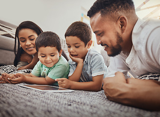 Image showing Family, parents and children with tablet, watch video online or streaming with wifi at home and relax, internet and bond. Happy, together and screen time with technology, man and woman with kids