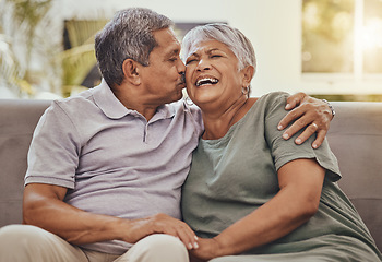 Image showing Happy, senior couple and kiss of elderly woman and man laughing with happiness on a sofa. Living room, couch and marriage support of people in retirement with love and joy together in a house lounge