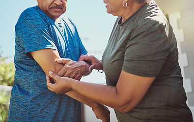 Image showing Senior, man arm injury and woman helping husband after exercise, fitness and workout accident. Elderly, arthritis and joint pain with a couple in retirement outdoor for health and wellness activity