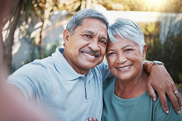 Image showing Love, selfie and portrait of a senior couple sitting outdoor in the backyard of a house. Happy, smile and elderly man and woman pensioners in retirement taking picture while relaxing in a home garden