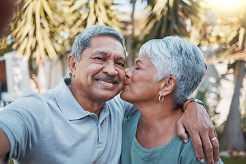 Image showing Senior couple, selfie and kiss outdoor portrait with love, happiness and care with a smile in garden. Happy retirement, profile picture and hug of elderly people enjoying life and marriage