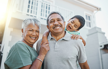 Image showing Portrait, piggyback and happy grandparents with a child in the backyard of their family home. Happiness, smile and elderly man and woman in retirement bonding with their grandson outdoor their house.