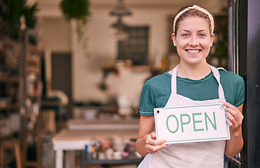 Image showing Woman, pottery and small business with open sign for creative startup, welcome or entrepreneurship at retail store. Portrait of happy shop owner with smile by entrance ready for service at the door