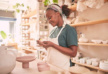 Image showing Pottery, craft and black woman creating with clay for her small business in creative workshop. Creativity, handicraft and African female potter entrepreneur manufacturing product with mud for a store