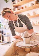 Image showing Woman, clay artist and pottery wheel for sculpture design, creative manufacturing and expert focus in studio workshop. Female, mud process and small business designer working with ceramic craft